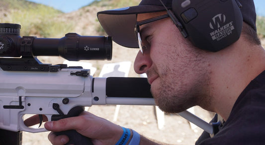 A man aiming with an lpvo scope