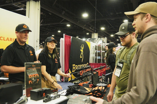 a booth with LPVOs and other hunting gear on sale